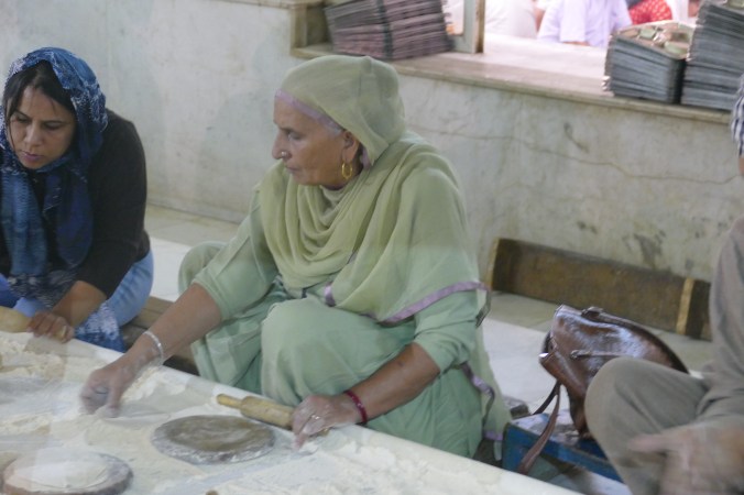 woman making naan